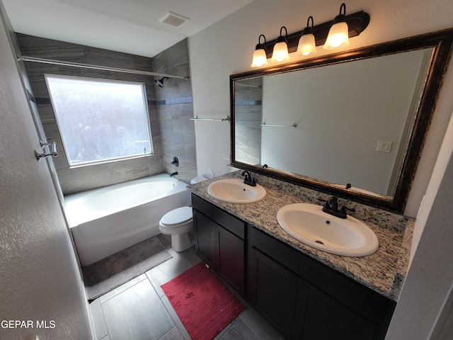 13611 Everingham St, El Paso, TX 79928 - full bathroom featuring  shower combination, double vanity, and toilet