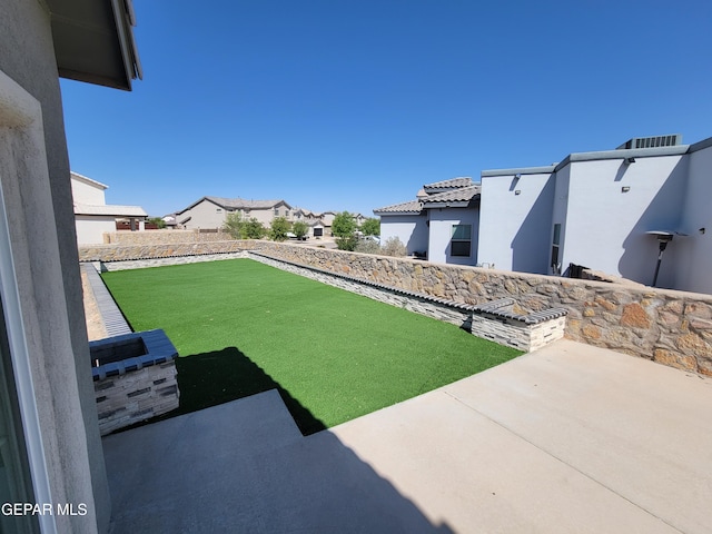 13611 Everingham St, El Paso, TX 79928 - view of yard featuring a patio and a residential view