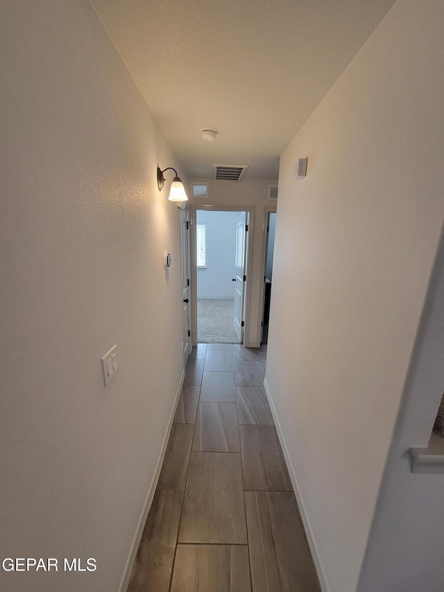 13611 Everingham St, El Paso, TX 79928 - corridor featuring baseboards and wood finish floors