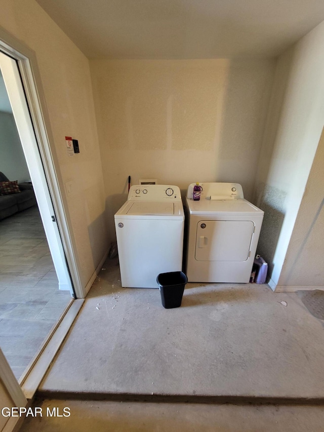 13611 Everingham St, El Paso, TX 79928 - laundry area with washing machine and clothes dryer and baseboards