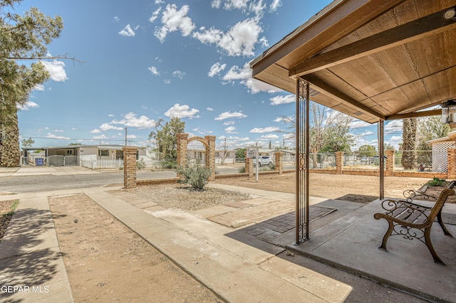 view of patio featuring fence