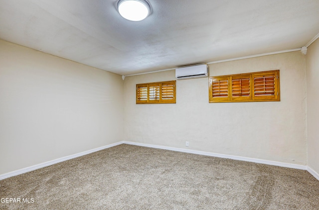 carpeted empty room featuring a wall unit AC and baseboards