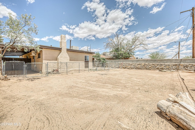 fenced yard with a gate