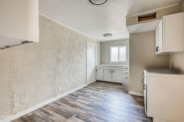5032 Catskill Ave, El Paso, TX 79904 - laundry room with light wood-style floors, a textured wall, and baseboards