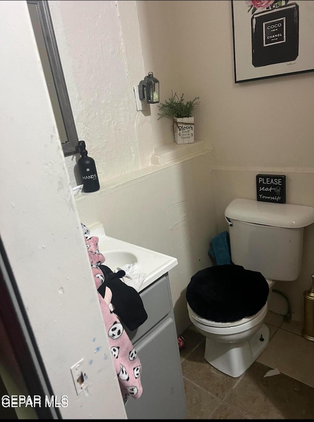 716 N Glenwood St, El Paso, TX 79905 - bathroom featuring tile patterned flooring, vanity, and toilet
