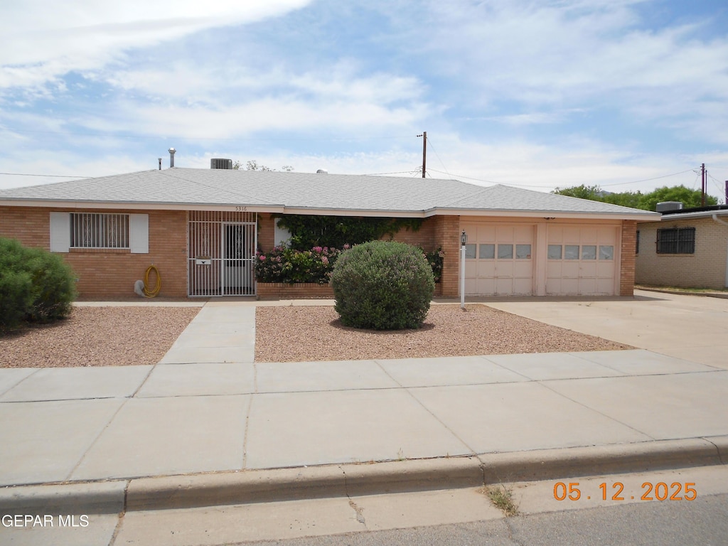 5316 Annette Ave, El Paso, TX 79924 - ranch-style home featuring driveway, an attached garage, and brick siding