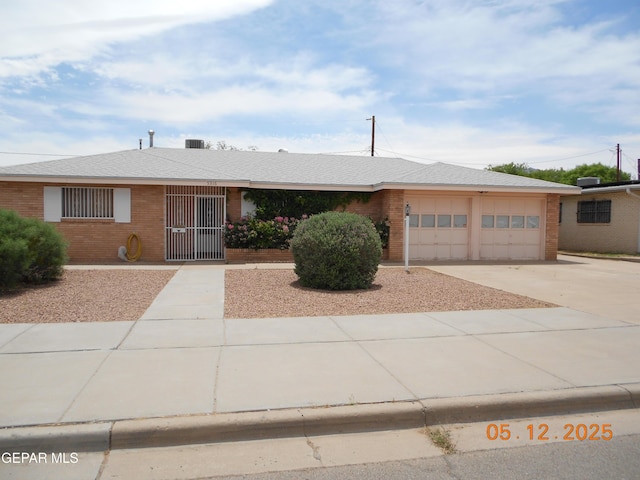 5316 Annette Ave, El Paso, TX 79924 - ranch-style home featuring driveway, an attached garage, and brick siding