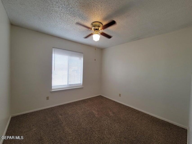 7716 Iroquois Dr, El Paso, TX 79912 - empty room featuring ceiling fan, dark colored carpet, a textured ceiling, and baseboards