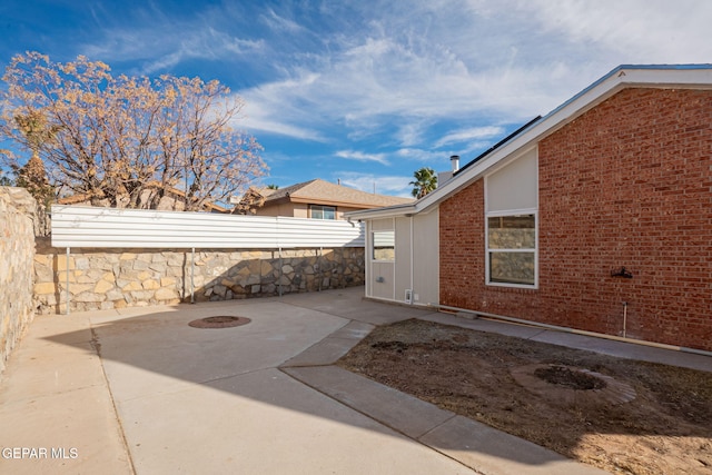 12033 Fred Carter Dr, El Paso, TX 79936 - view of patio / terrace with a fenced backyard and an outdoor fire pit