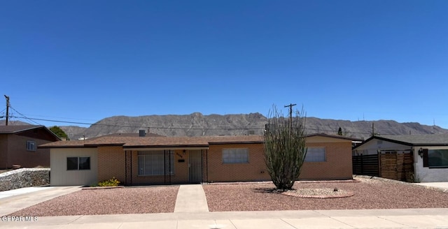 6044 Cabrillo Dr, El Paso, TX 79912 - ranch-style home featuring a mountain view and brick siding