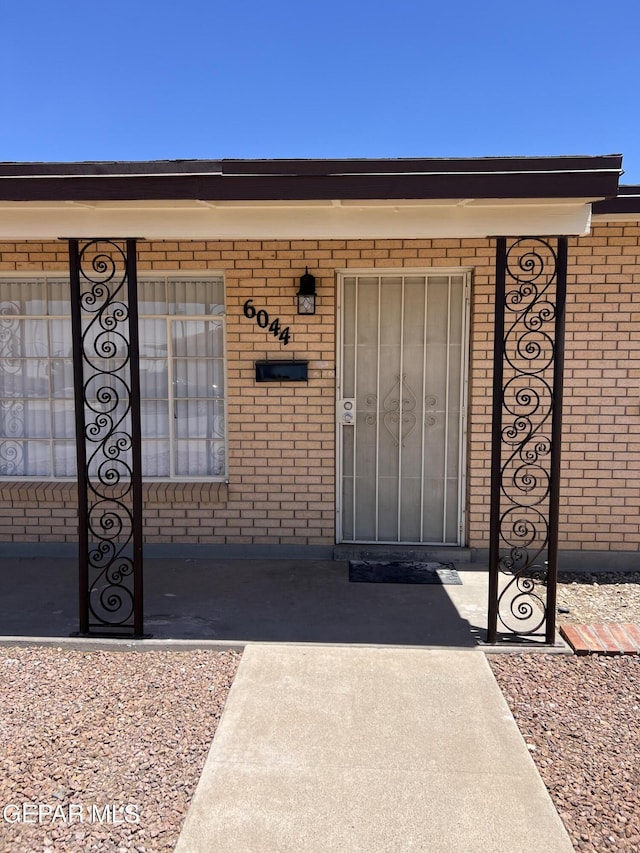 6044 Cabrillo Dr, El Paso, TX 79912 - view of exterior entry featuring brick siding