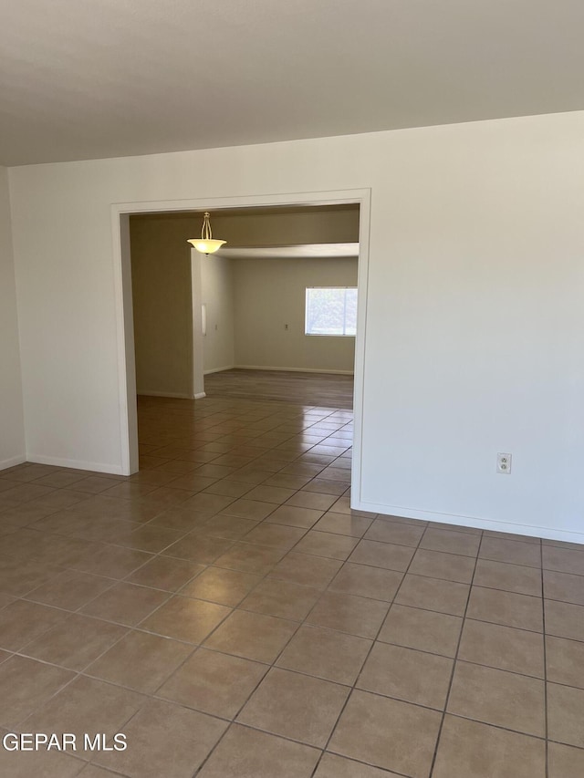 6044 Cabrillo Dr, El Paso, TX 79912 - empty room featuring light tile patterned floors and baseboards