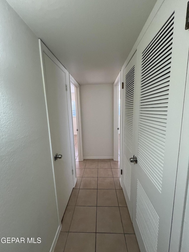 6044 Cabrillo Dr, El Paso, TX 79912 - hall with tile patterned floors and baseboards