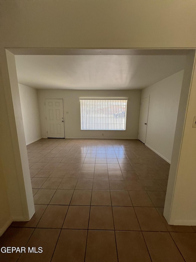 6044 Cabrillo Dr, El Paso, TX 79912 - tiled empty room with baseboards