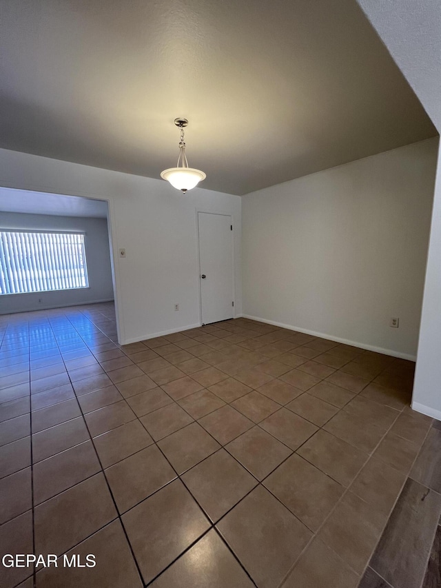 6044 Cabrillo Dr, El Paso, TX 79912 - empty room with tile patterned floors and baseboards