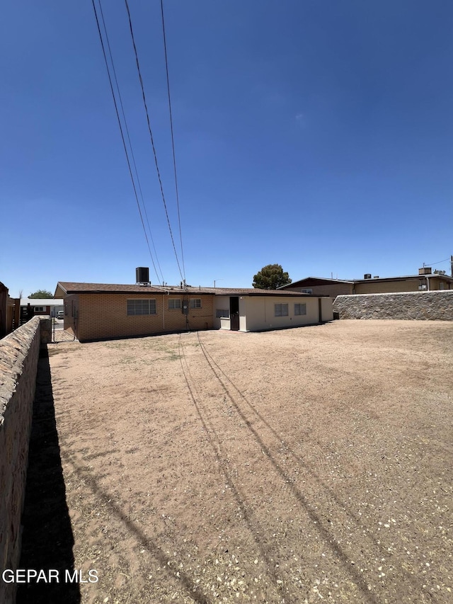 6044 Cabrillo Dr, El Paso, TX 79912 - rear view of house featuring fence