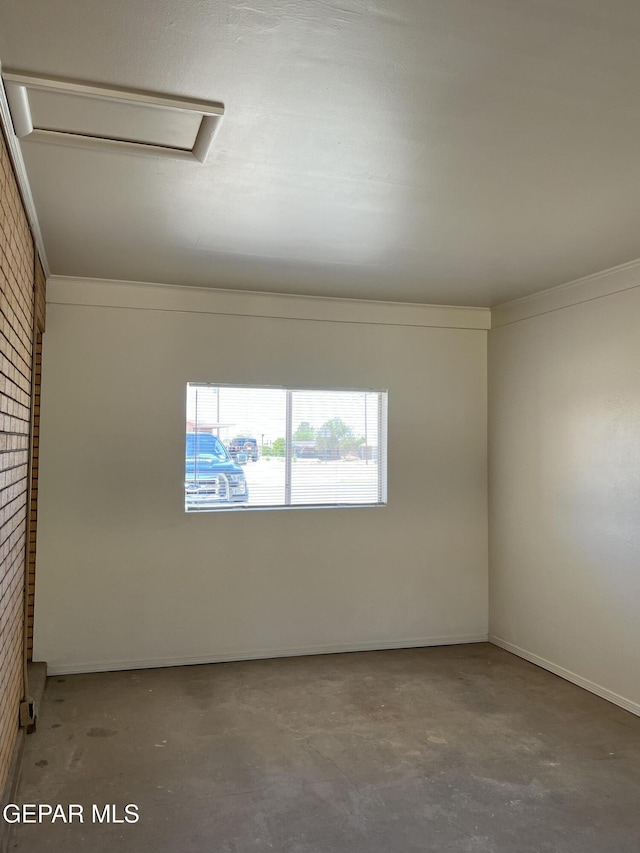 6044 Cabrillo Dr, El Paso, TX 79912 - spare room featuring concrete flooring and attic access
