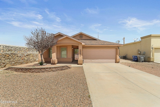 13001 Lost Willow, El Paso, TX 79938 - view of front of home featuring stucco siding, a garage, driveway, and a porch