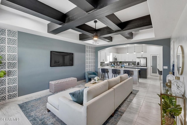 10705 Troy Aikman Dr, El Paso, TX 79924 - living room featuring arched walkways, coffered ceiling, beamed ceiling, and a ceiling fan