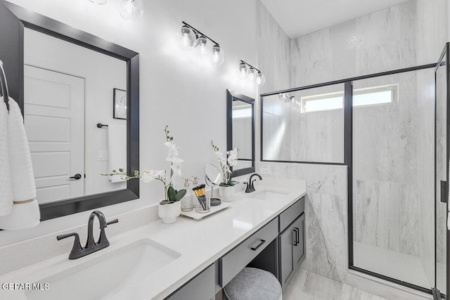 10705 Troy Aikman Dr, El Paso, TX 79924 - full bathroom featuring a stall shower, double vanity, and marble finish floors