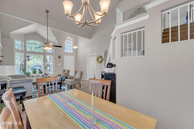 12572 Paseo Alegre Dr, El Paso, TX 79928 - dining area with high vaulted ceiling, ceiling fan, and a chandelier