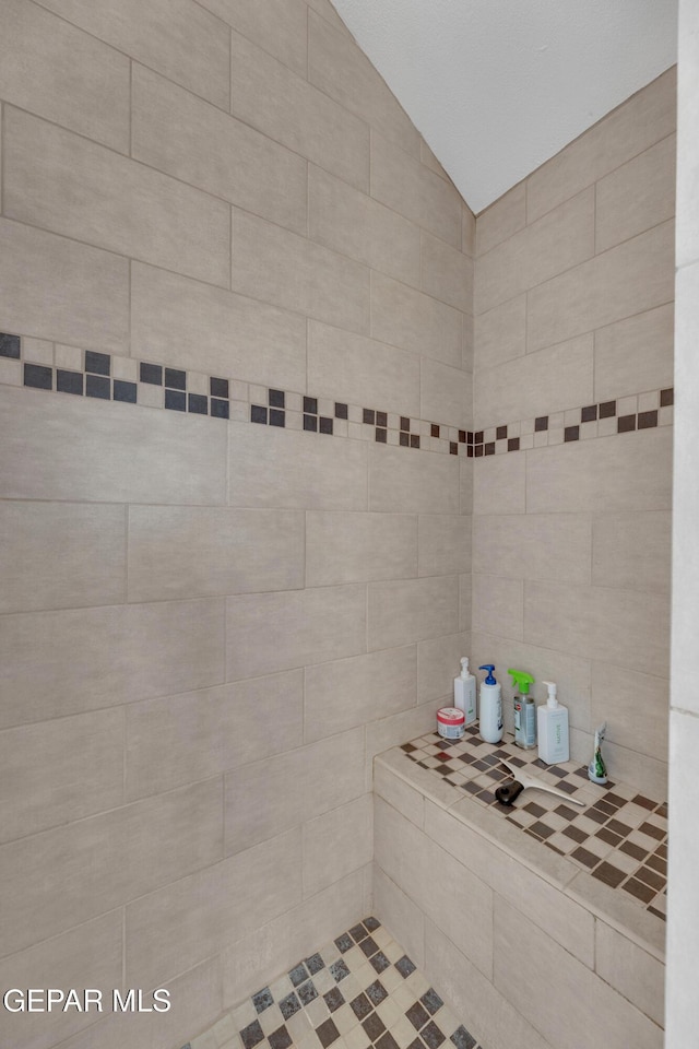 12572 Paseo Alegre Dr, El Paso, TX 79928 - full bathroom with lofted ceiling and a tile shower