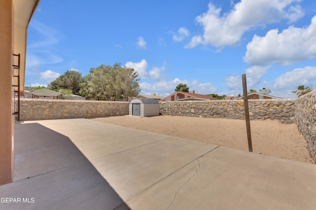 12273 El Greco Cir, El Paso, TX 79936 - view of patio featuring a shed, an outbuilding, and a fenced backyard