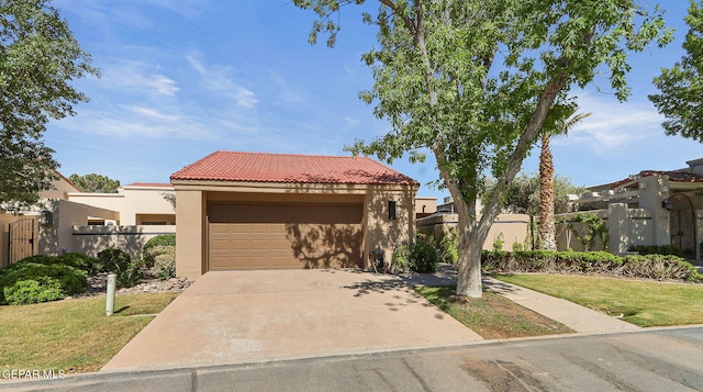 1114 Los Jardines Cir, El Paso, TX 79912 - mediterranean / spanish home with stucco siding, a tiled roof, a garage, and concrete driveway