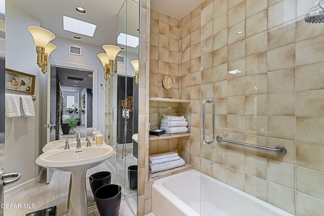 1114 Los Jardines Cir, El Paso, TX 79912 - full bathroom featuring a skylight, a bathtub, a shower, and recessed lighting