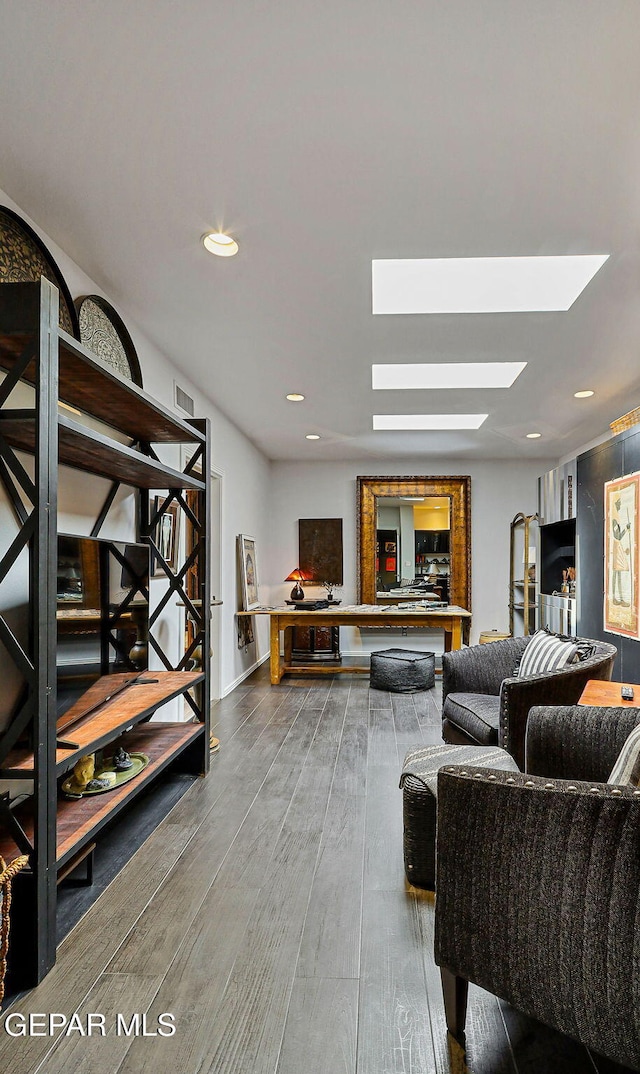 1114 Los Jardines Cir, El Paso, TX 79912 - living area featuring a skylight, wood finished floors, and recessed lighting