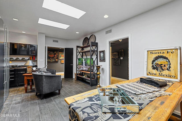 1114 Los Jardines Cir, El Paso, TX 79912 - dining space with dark wood finished floors, recessed lighting, and a skylight
