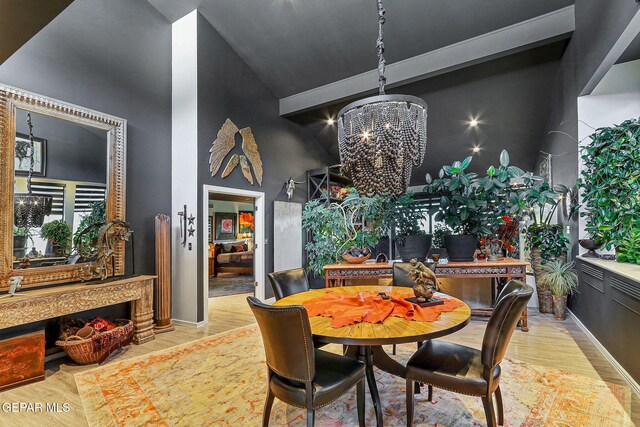 1114 Los Jardines Cir, El Paso, TX 79912 - dining room featuring a chandelier, high vaulted ceiling, and wood finished floors
