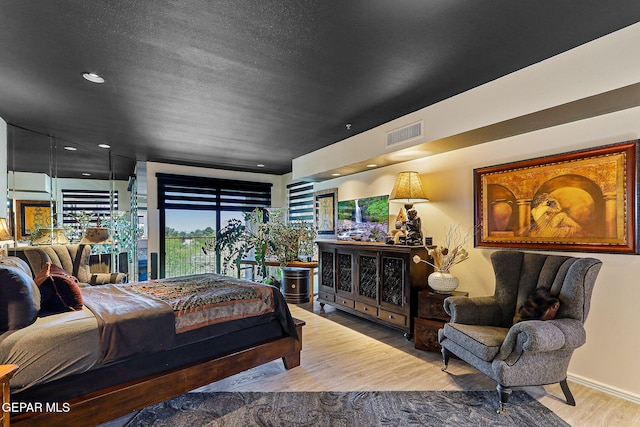 1114 Los Jardines Cir, El Paso, TX 79912 - bedroom with wood finished floors and recessed lighting