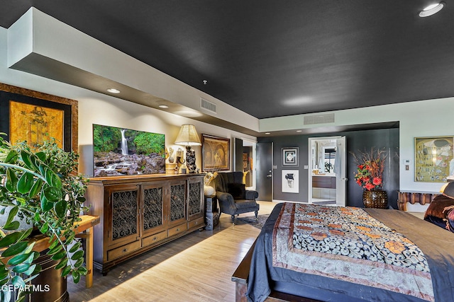 1114 Los Jardines Cir, El Paso, TX 79912 - bedroom featuring wood finished floors, recessed lighting, and ensuite bathroom