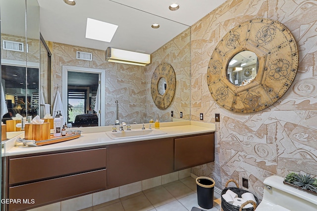 1114 Los Jardines Cir, El Paso, TX 79912 - bathroom with tile patterned flooring, vanity, toilet, and recessed lighting