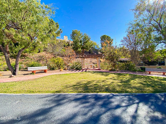 1114 Los Jardines Cir, El Paso, TX 79912 - surrounding community featuring a pergola and a yard