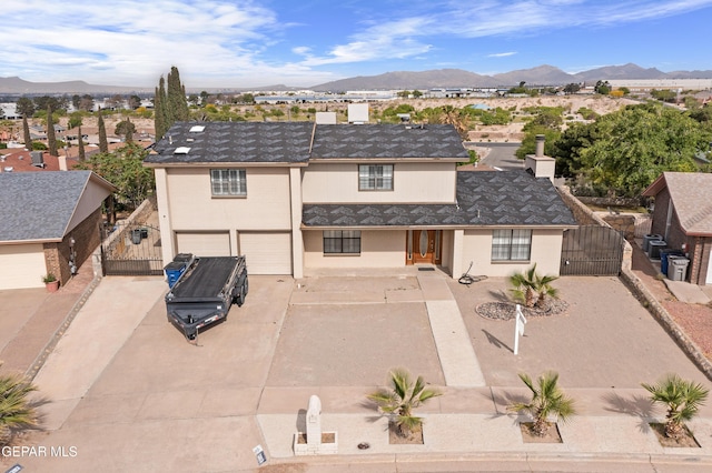 1393 Vista Granada Dr, El Paso, TX 79936 - view of front of house featuring a gate, driveway, an attached garage, and a mountain view