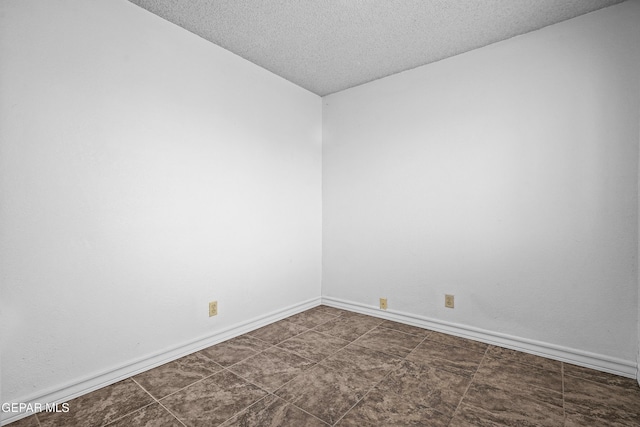1393 Vista Granada Dr, El Paso, TX 79936 - spare room featuring a textured ceiling and baseboards
