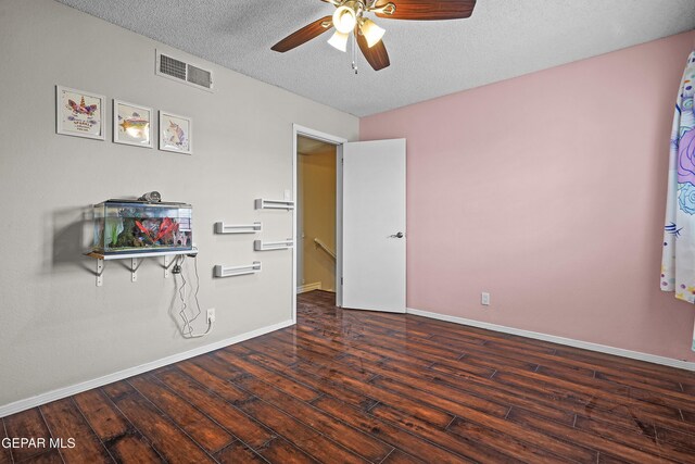 1393 Vista Granada Dr, El Paso, TX 79936 - unfurnished bedroom featuring wood finished floors, a textured ceiling, baseboards, and ceiling fan