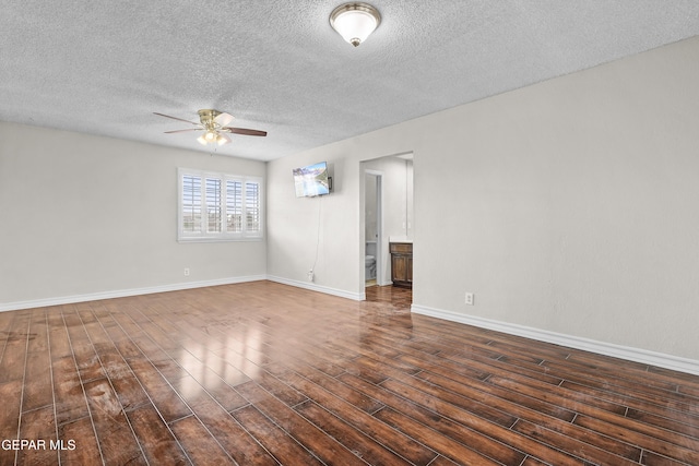 1393 Vista Granada Dr, El Paso, TX 79936 - unfurnished room featuring a ceiling fan, a textured ceiling, wood finished floors, and baseboards