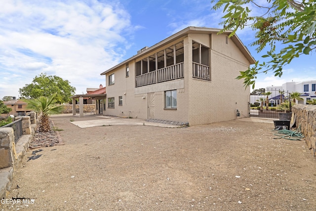 1393 Vista Granada Dr, El Paso, TX 79936 - back of property featuring brick siding, a patio area, and fence