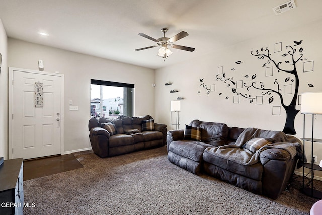 living room featuring a ceiling fan, carpet, and baseboards