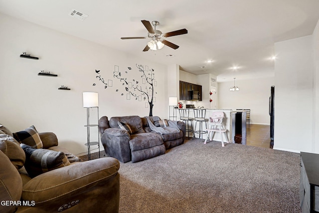 living area featuring a ceiling fan, dark carpet, baseboards, and recessed lighting