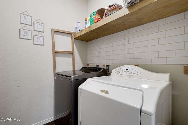 laundry area with washing machine and dryer