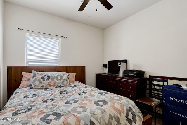 bedroom with ceiling fan and lofted ceiling