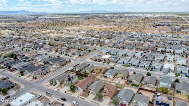 aerial view of property's location featuring mountains and nearby suburban area