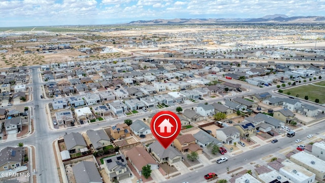 aerial view of property's location with mountains and nearby suburban area