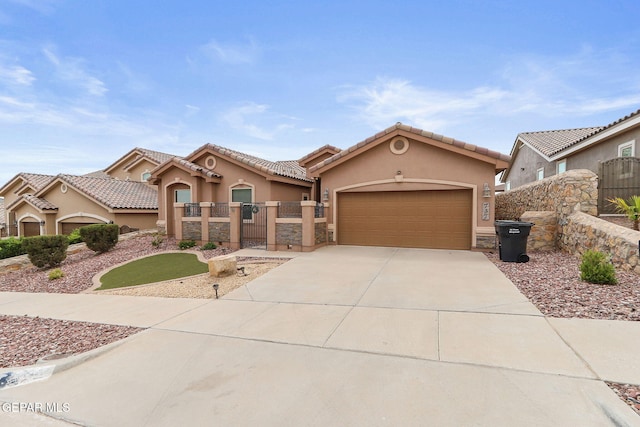 737 Colonial Blf, El Paso, TX 79928 - view of front facade featuring stucco siding, concrete driveway, a garage, and a gate