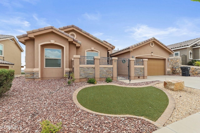 737 Colonial Blf, El Paso, TX 79928 - mediterranean / spanish house featuring concrete driveway, stucco siding, a gate, fence, and a garage