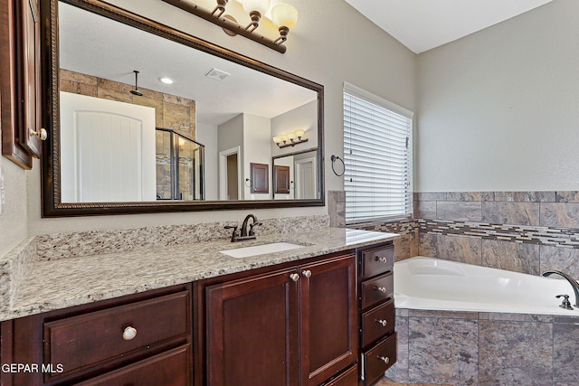 737 Colonial Blf, El Paso, TX 79928 - full bathroom with a stall shower, vanity, and a garden tub